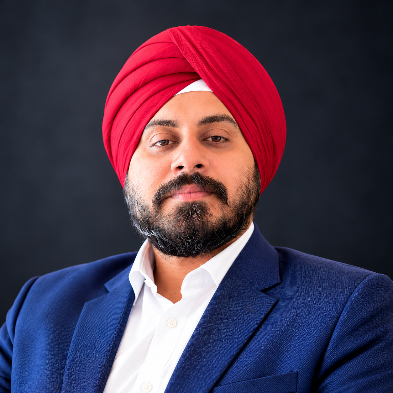 Sunpreet Singh Kalsi in a red turban and navy blue blazer